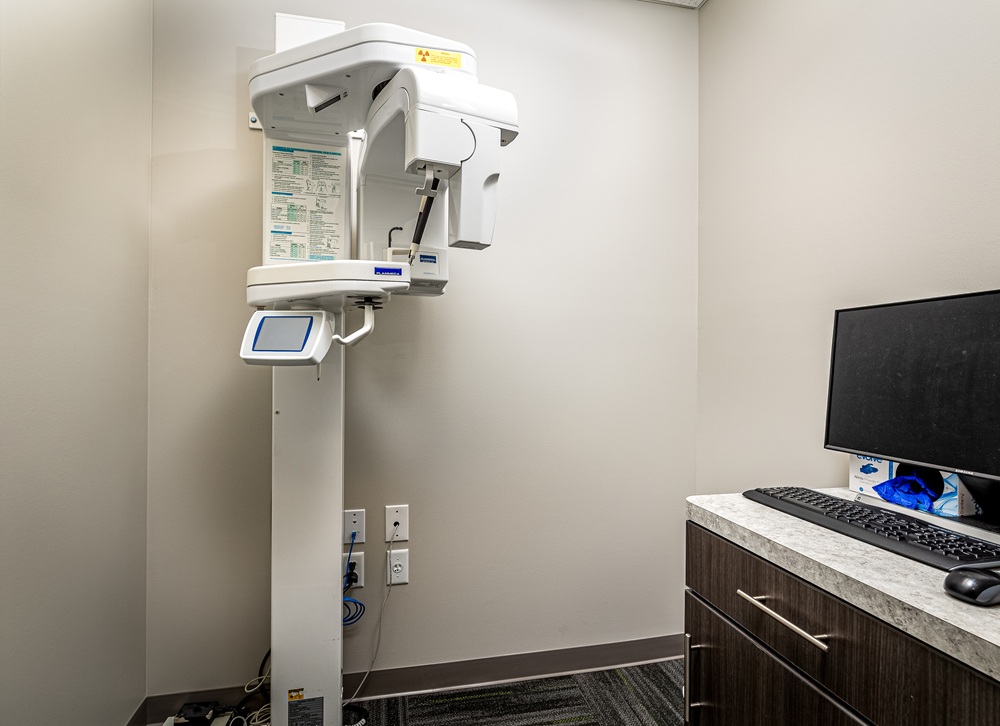 Panoramic 3D CBCT digital imaging machine inside the diagnostic room at West Broad Dental.