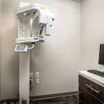 Panoramic 3D CBCT digital imaging machine inside the diagnostic room at West Broad Dental.