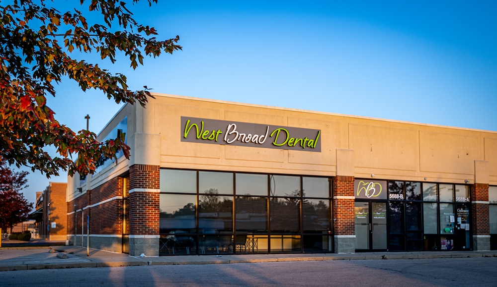 Exterior view of the West Broad Dental clinic building showing the entrance and primary signage.
